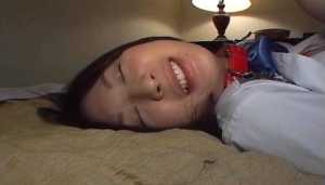 Dressed Asian schoolgirl licks toes and gives blowjob